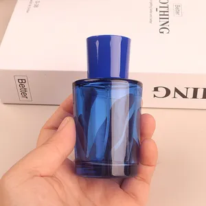 50ml blue glass perfume bottle with spray pump, empty cosmetic decant container for travel.