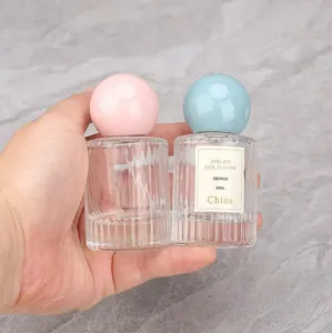 Portable 30ml round cap glass perfume bottle empty cosmetic sub packaging container for travel.