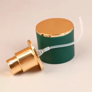 Gold and green perfume sprayer pump component with clear dip tube, ideal for cosmetic sub-bottles.