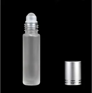 Detailed view of 10ml frosted glass essential oil roller bottle with silver cap, empty.