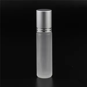 Frosted glass essential oil roller bottle detail, silver cap close up, 10ml empty cosmetic container