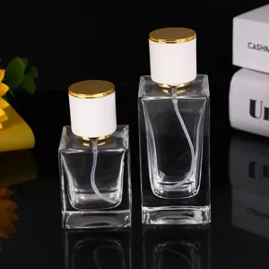 30ml 50ml quadratische klare Glas Parfümflasche mit weißem und goldener Sprühkappe.