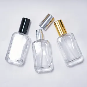 Clear glass perfume bottle detail view, 30ml empty spray bottle with multiple color caps.