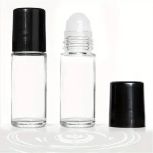Flacon roll-on en verre transparent de 50 ml avec bouchon noir pour massage aromatique.