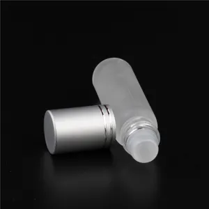 Frosted glass roller bottle detail, 10ml essential oil sub-bottle with smooth roller ball.