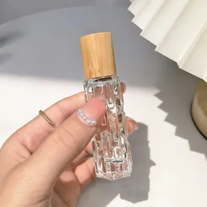 Flacon roll-on en verre transparent avec bouchon en bambou pour huiles essentielles