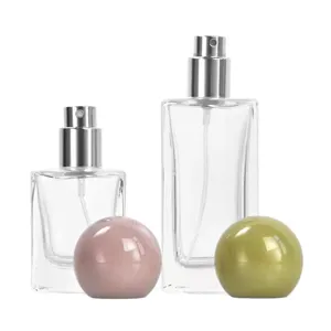 Portable square 30/50ml glass perfume refillable spray bottle with colorful spherical cap.