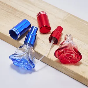Frasco de perfume de vidrio en forma de rosa de 6ml recargable con tapa de metal.