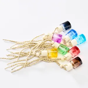 Detailed view of colorful glass car perfume bottles with wooden caps and hanging ropes.