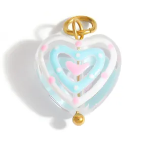 Detailed macro view of a colorful sweet multi-layered heart-shaped glazed glass pendant