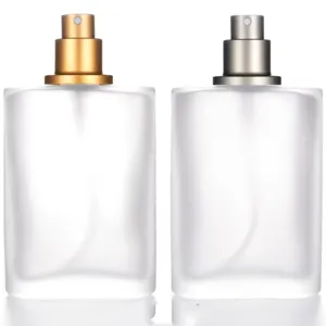 Frosted glass perfume bottle detail, refillable empty spray container with metal pump sprayer.