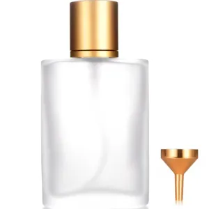 Frosted glass perfume bottle detail view with gold cap and mini metal funnel for easy filling.