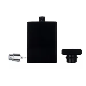 Detail view of 100ml black square glass perfume bottle with spray pump and matching cap.