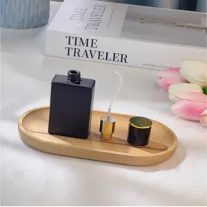 Frasco de perfume negro mate recargable con boquilla de spray, dispensador cosmetico portatil.