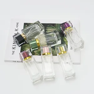 50ml glass perfume bottles with square colored caps, empty spray atomizers for travel use.