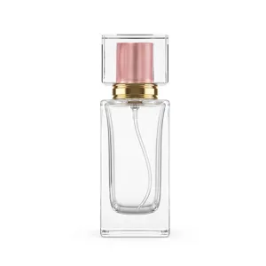 Close-up detail view of the clear glass perfume bottle with square transparent cap and gold pump.