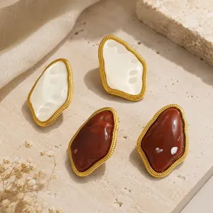 Detail view of vintage irregular geometric resin earrings in cream and brown tones