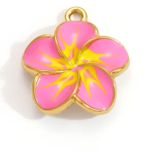Close-up macro view of pink and yellow enamel plumeria flower pendant for DIY jewelry making