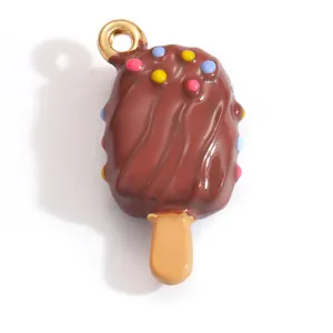 Detailed macro view of chocolate popsicle charm with colorful sprinkles and gold metal loop