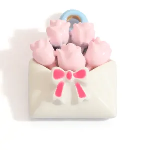 Close-up detail of a sweet pink rose bouquet in an envelope pendant for DIY jewelry