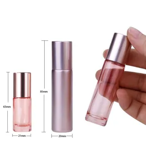Detailed view of glass roll-on bottles with metal caps, showing precise dimensions for travel.