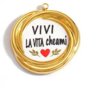 Detailed macro view of gold stainless steel pendant with VIVI LA VITA text and heart