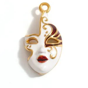 Detail view of a gold-plated stainless steel opera mask pendant with enamel accents