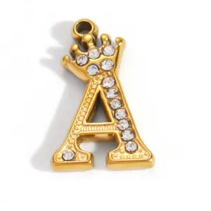Detail view of a gold-plated stainless steel letter A pendant with sparkling rhinestones