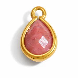 Close-up of a faceted pink natural stone teardrop pendant with gold setting.