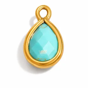 Detailed close-up of a teardrop-shaped turquoise stone pendant in a gold stainless steel frame