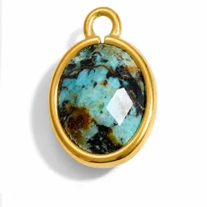 Detailed macro shot of gold stainless steel oval pendant featuring unique natural stone inlay