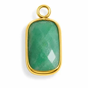 Close-up of a green faceted natural stone pendant with gold stainless steel bezel