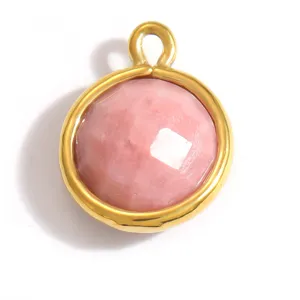 Macro view of pink faceted natural stone pendant with gold-plated stainless steel frame