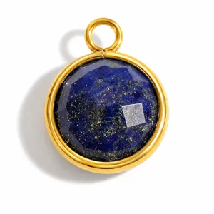 Macro detail of a faceted round natural lapis lazuli stone pendant in a gold finish bezel