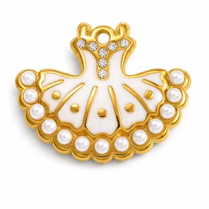 Vue détaillée d'un pendentif tutu de ballet doré avec perles en émail blanc et cristaux