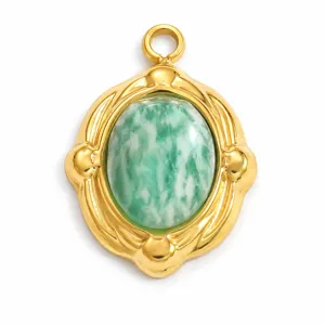Close-up of a vintage gold stainless steel pendant with green marbled natural stone.