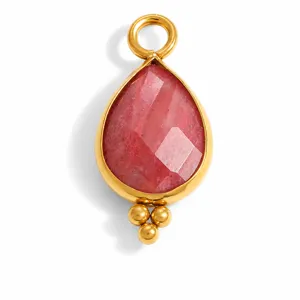 Macro detail view of a faceted pink natural stone waterdrop pendant with gold plating
