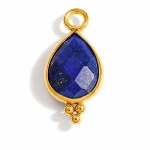 Close-up of faceted lapis lazuli teardrop pendant in gold plated stainless steel