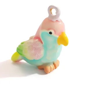 Close-up of colorful bird-shaped pendant with dopamine gradient colors for DIY jewelry.