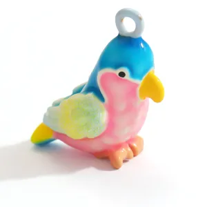 Detailed view of a bright parrot-shaped resin pendant with a vibrant dopamine color palette