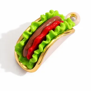 Detailed macro shot of a vibrant enamel hot dog charm for DIY jewelry design and crafting