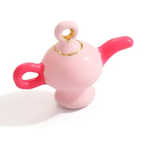 Detailed macro view of a pink and rose-red magic lamp ceramic pendant for DIY jewelry.