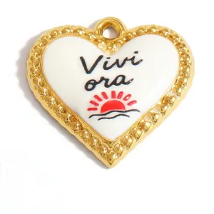 Close-up of heart-shaped gold-toned pendant with Vivi ora Italian text