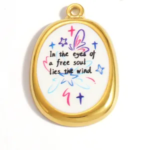 Close-up detail of oval stainless steel pendant featuring a free soul quote and colorful butterflies