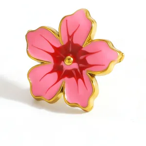 Detail showing pink flower shoe buckle with golden edges and red floral center.