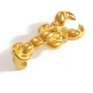 Detailed close-up of a golden lobster claw shoe charm for DIY clog decoration