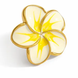 Close-up detail of a white and yellow plumeria flower shoe charm for clogs