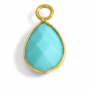 Close-up of teardrop-shaped turquoise stone pendant with gold stainless steel frame