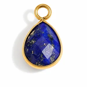 Macro detail of teardrop lapis lazuli pendant with gold stainless steel bezel