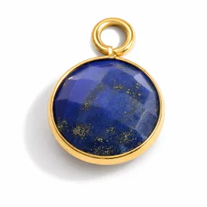 Detailed view of a faceted blue lapis lazuli stone pendant in a gold bezel
